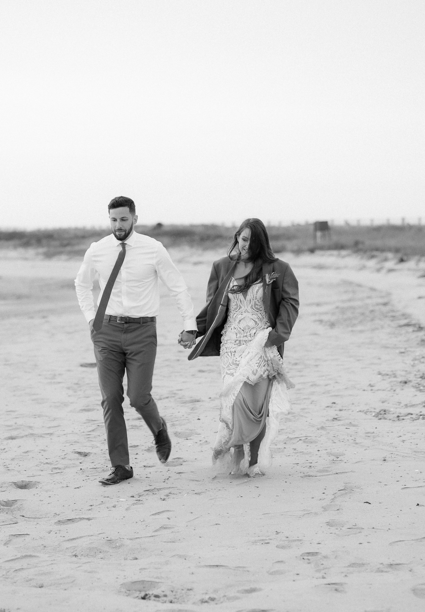 Couple eloping in spring on a beach in Cape Cod, MA