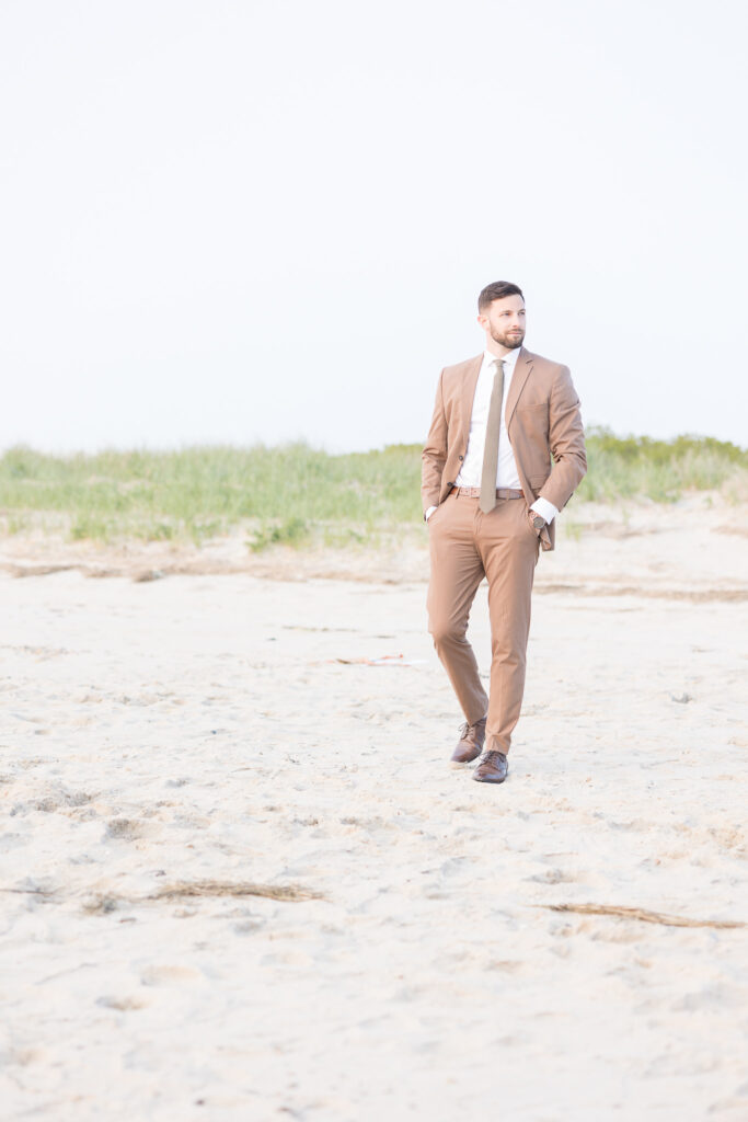 groom portrait at the beach