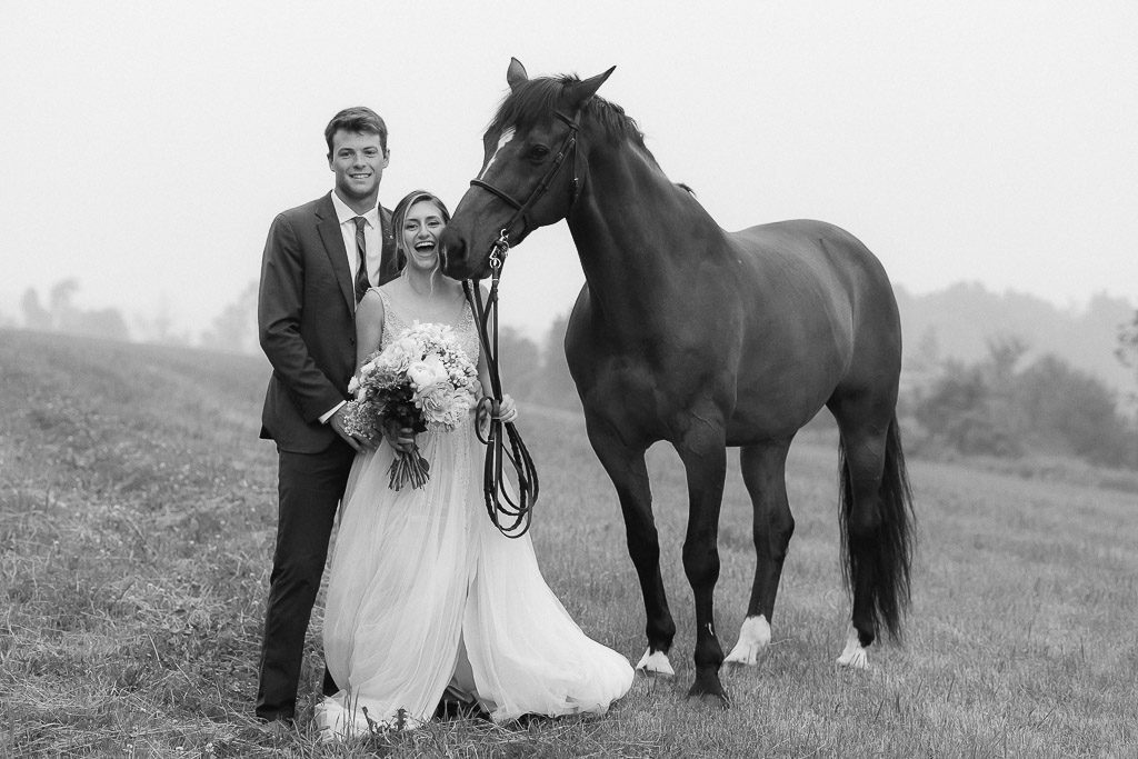 adventure elopement couple posing with a horse