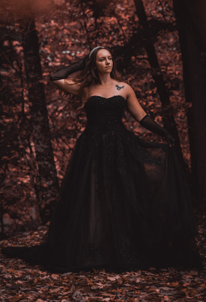 moody forest bridal portraits, bride is wearing a black wedding dress