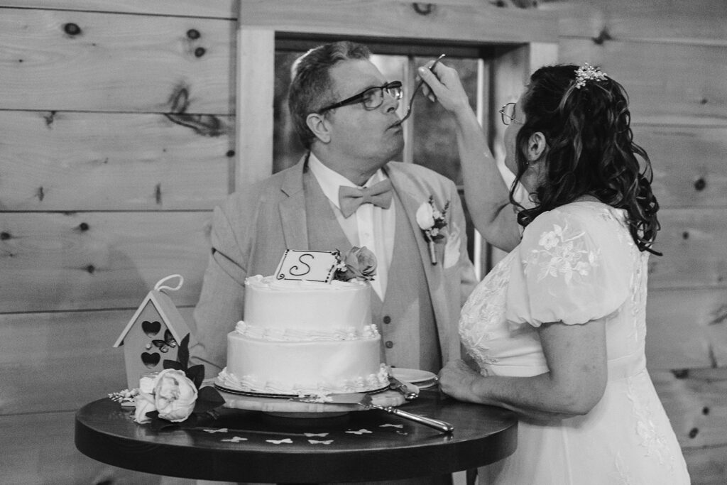 bride and groom eating cake