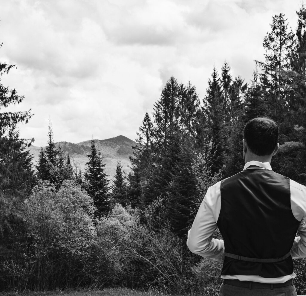 groom looking towards a mountain view