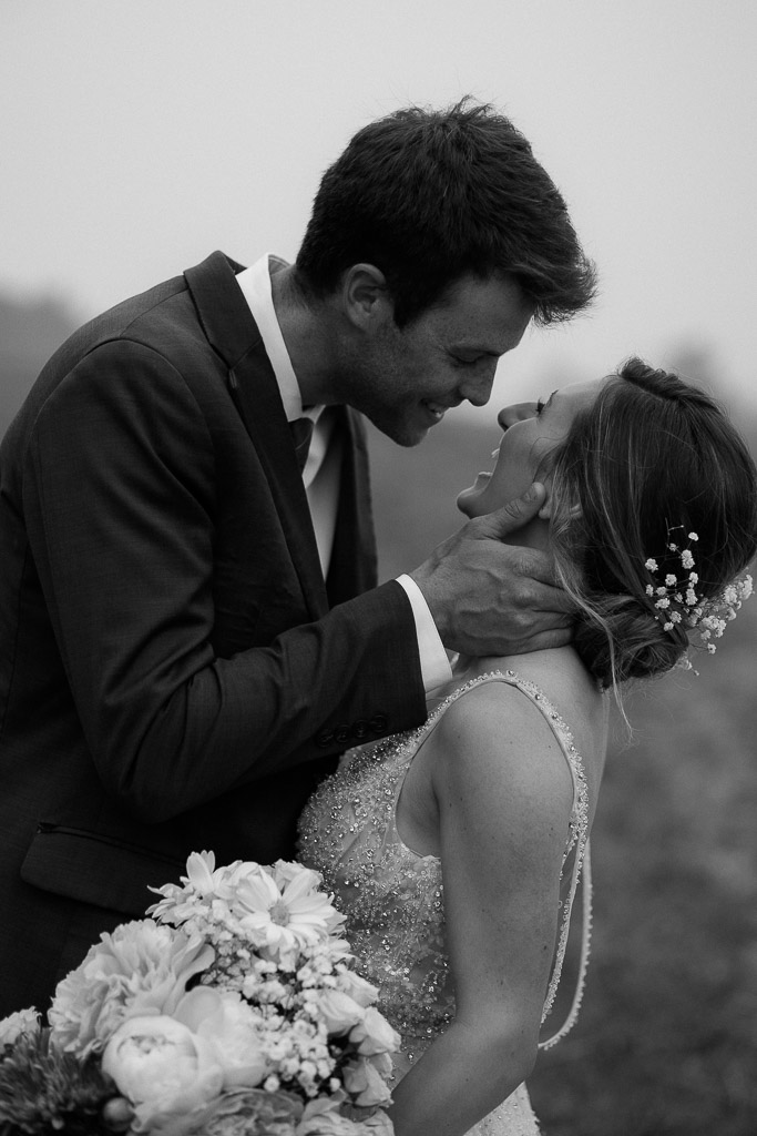 bride and groom in a field with  mountain backdrops during their berkshires elopement