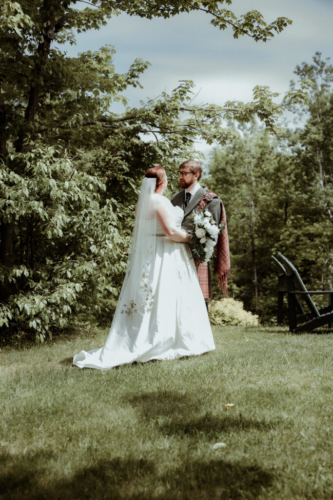 an elopement couple surrounded by lush greenery