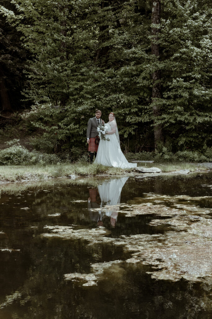 an elopement couple surrounded by lush greenery