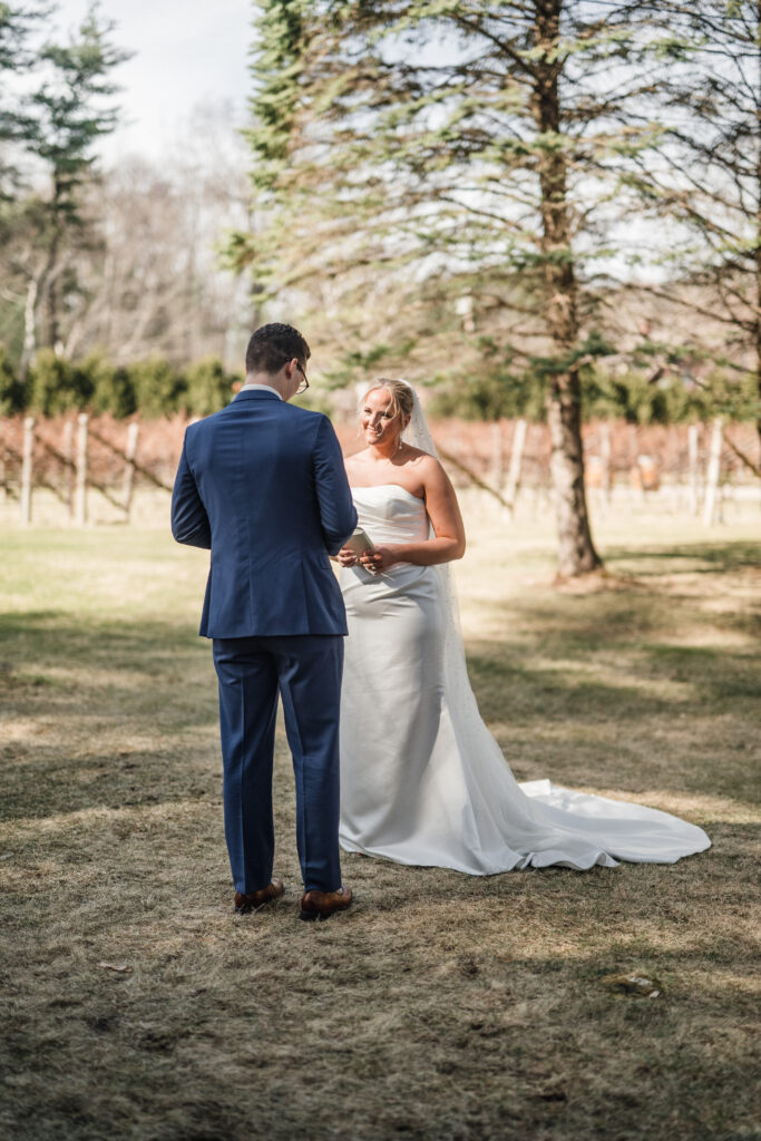 Couple exchanging vows during their Vermont fall wedding 
